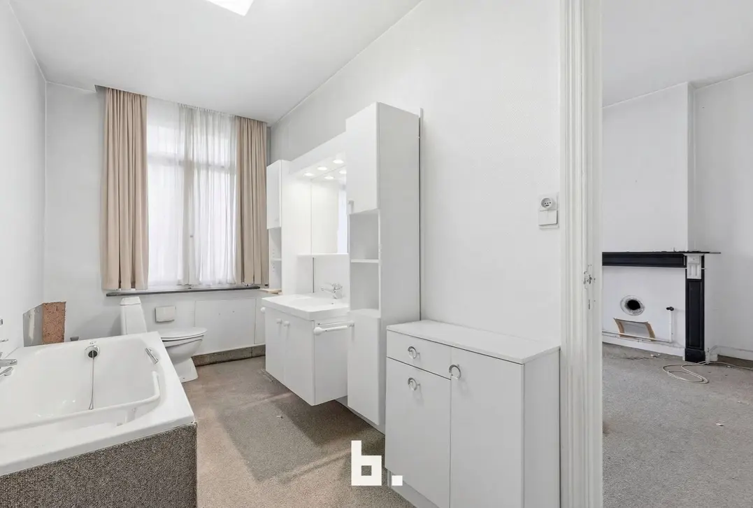 Handelshuis met woonst en tuin op toplocatie in centrum - Izegem